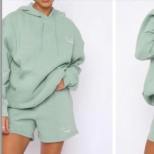 White fox, green jumper, good condition